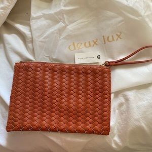 NWT burnt orange bag with wrist strap
